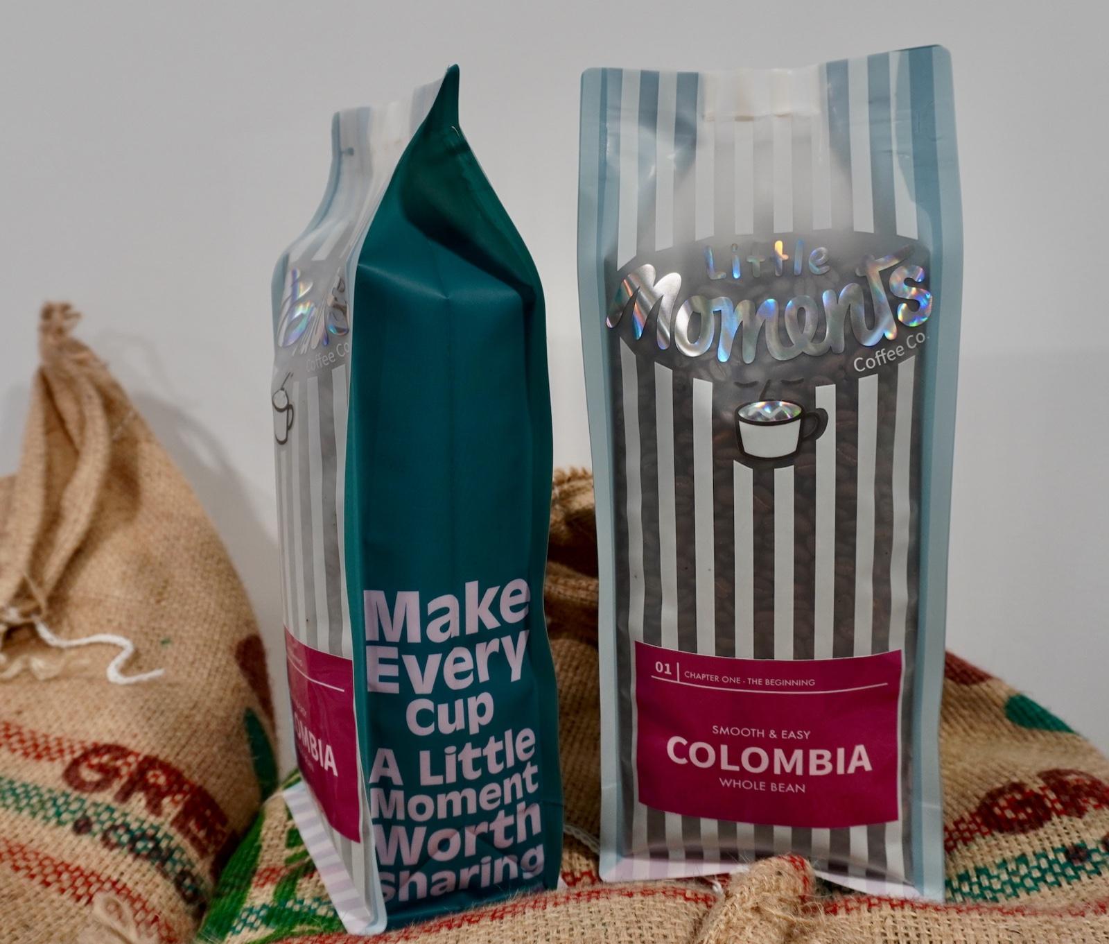 Two bags of Chapter One Colombia standing on jute coffee sacks