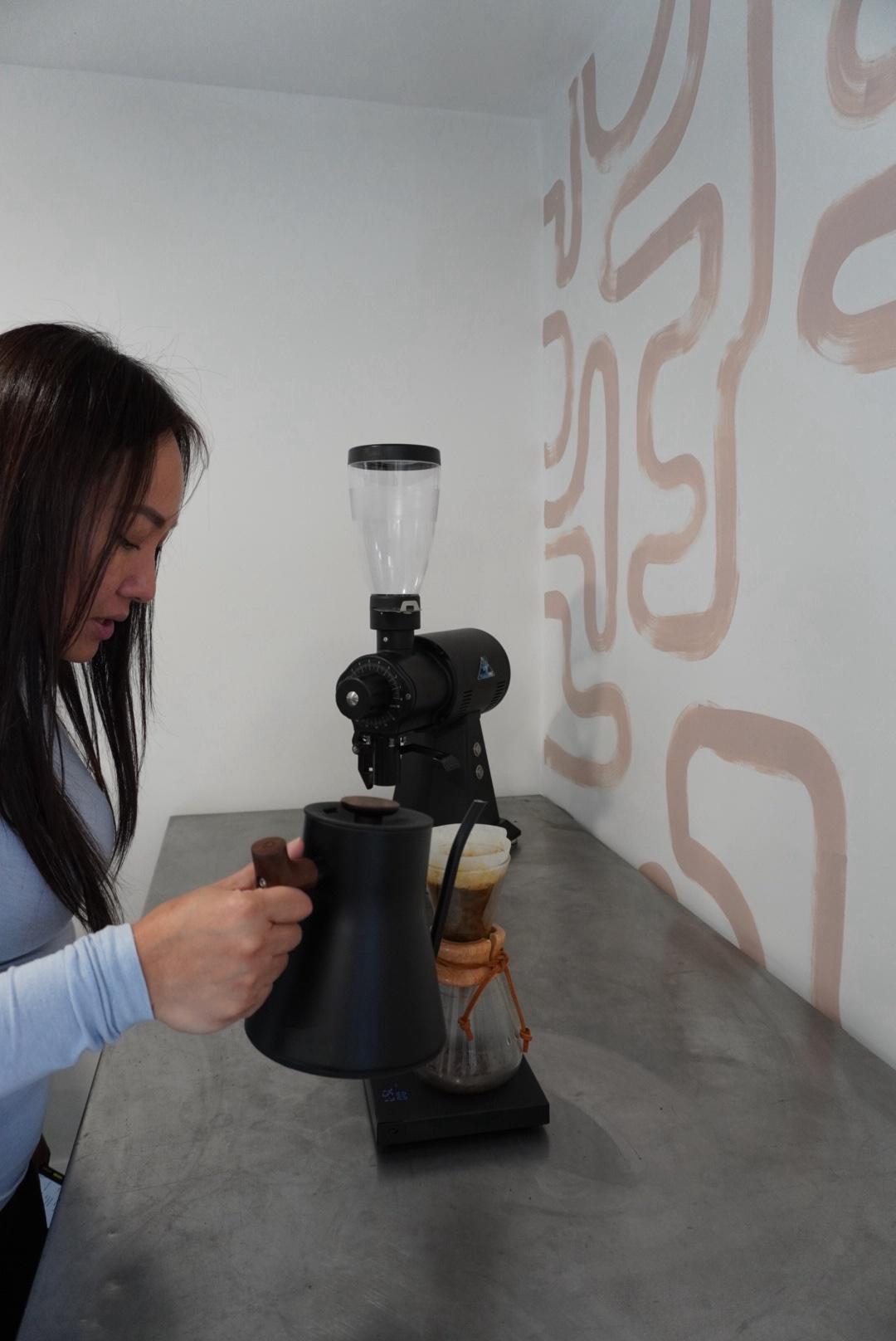 Pouring water over a Chemex in the roastery